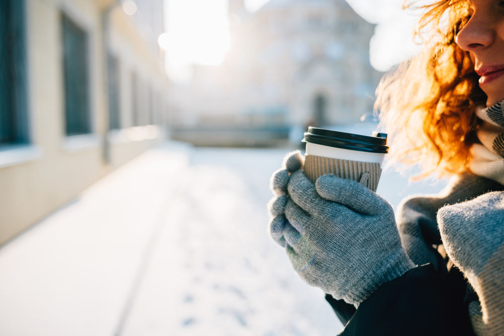 Close-up,Of,Happy,Young,Woman,Drinking,Coffee,Outside,In,City,